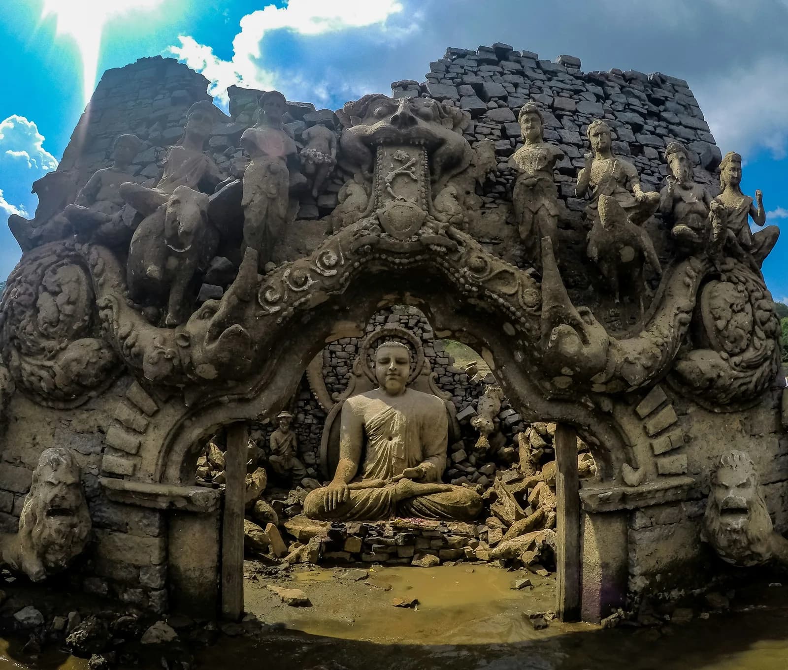 Peaceful seated Buddha statue carved in exquisite traditional Buddhist craftsmanship.