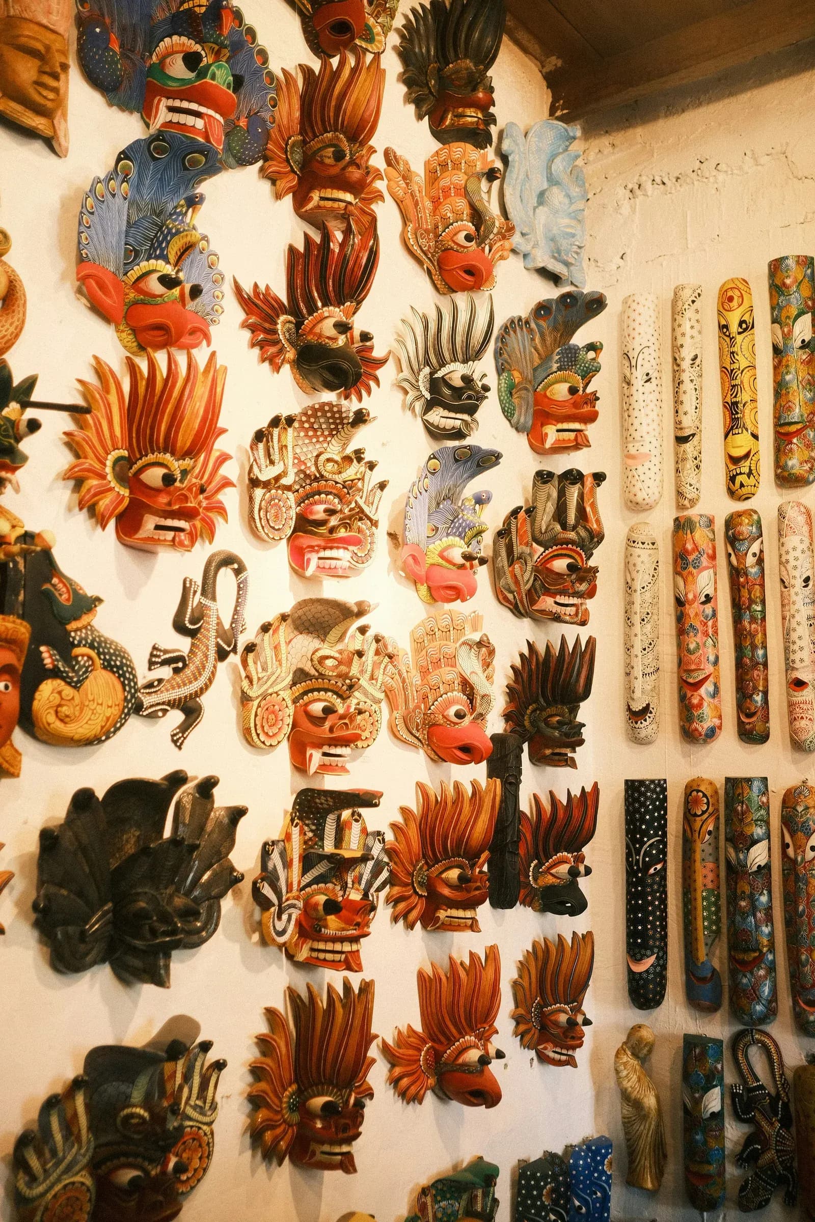 Authentic Sri Lankan cultural mask displayed in artisan workshop.