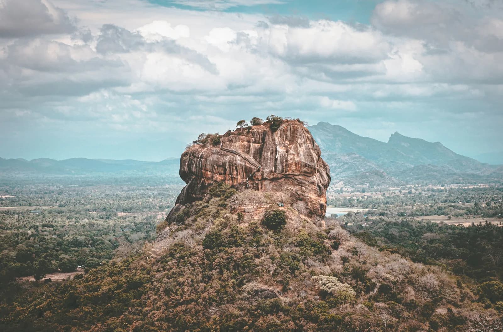 Majestic UNESCO Sigiriya Lion Rock Fortress surrounded by lush tropical nature in Sri Lanka.